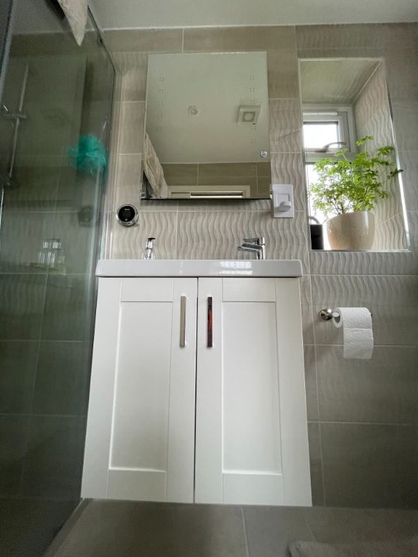 Floating cabinetry in wet room of large porch extension, designed by Inner Create in Stony Stratford