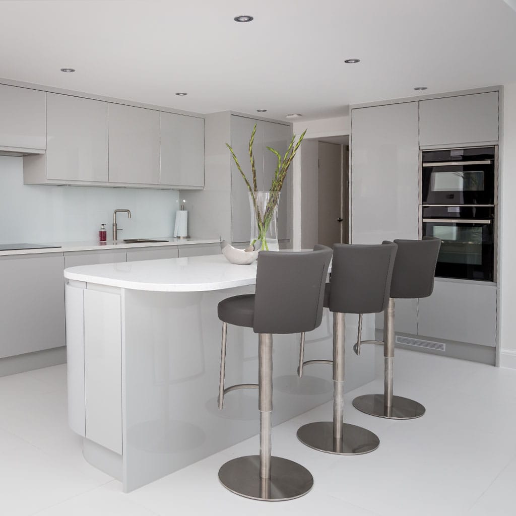 Modern kitchen extension with open-plan design, sleek cabinetry, and skylights in Milton Keynes.