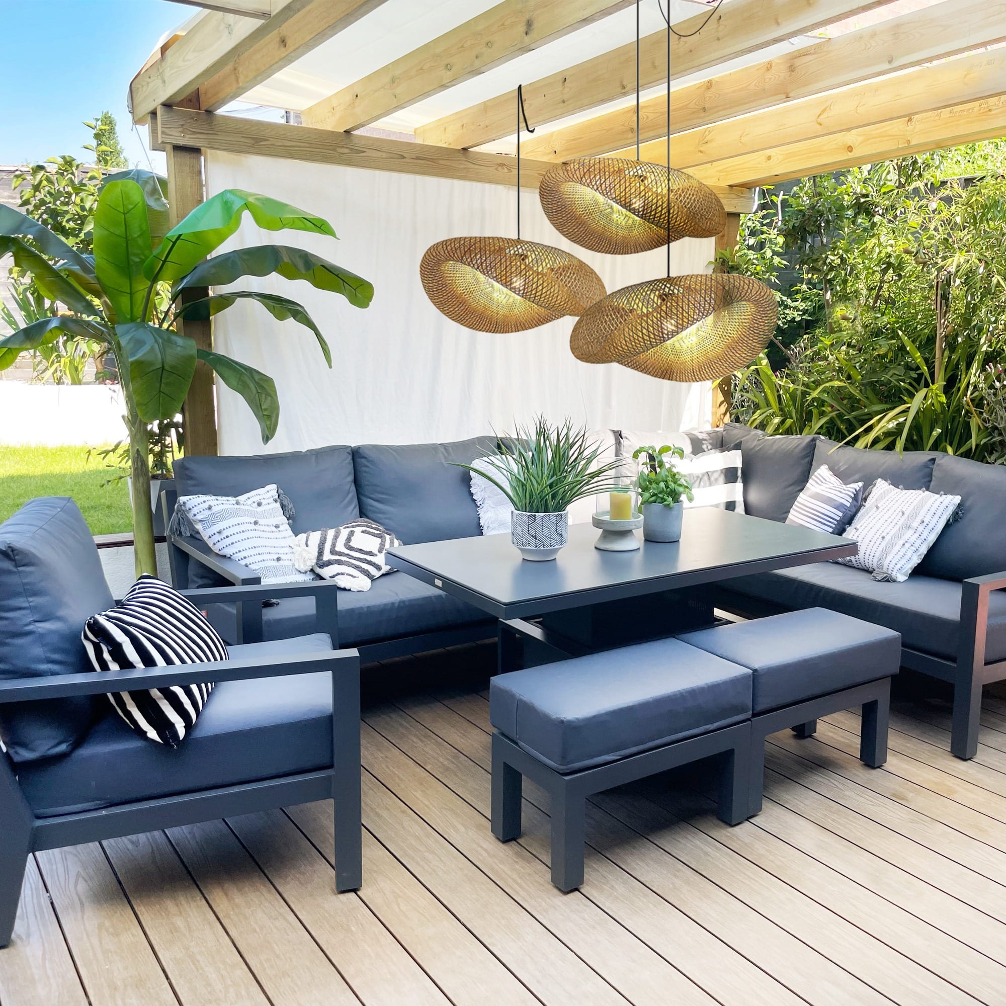 Stylish outdoor living space in Milton Keynes with comfortable seating, modern decor, and natural surroundings.